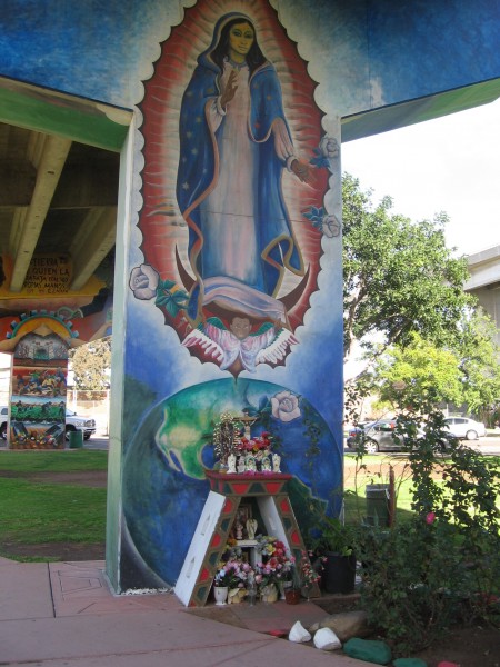 Virgin Mary and shrine at foot of Chicano Park mural.