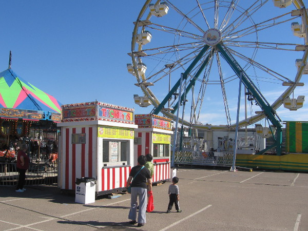 A big carnival area includes a Ferris wheel.