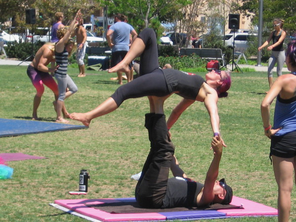 Practicing acrobatic skills at the AcroLove Festival in San Diego's Ruocco Park.