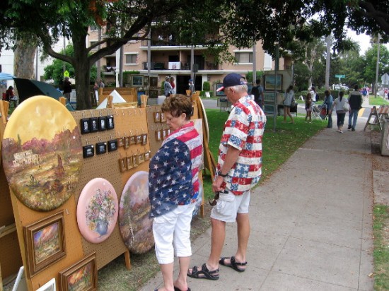 People check out art on display in Spreckels Park.