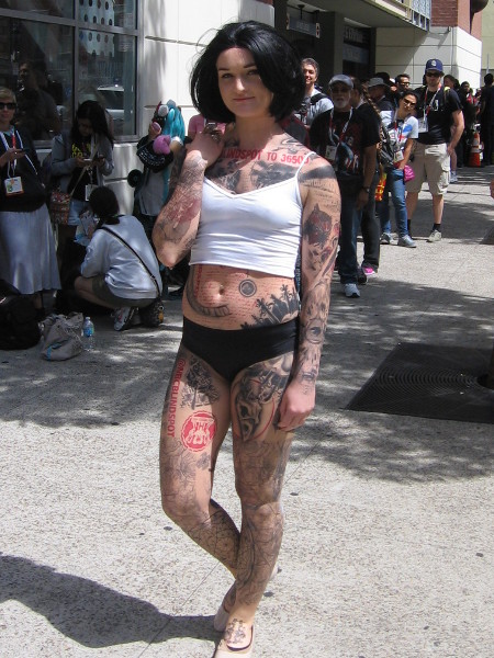 Sexy tattooed character from television show Blindspot walks about during 2015 San Diego Comic-Con.
