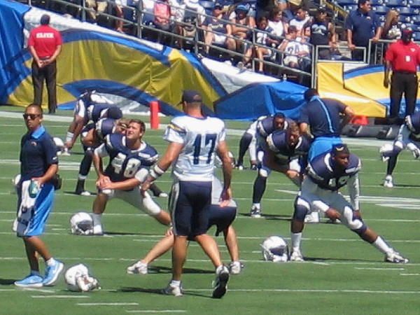 Superstar quarterback Philip Rivers provides leadership for the team during stretching exercises.