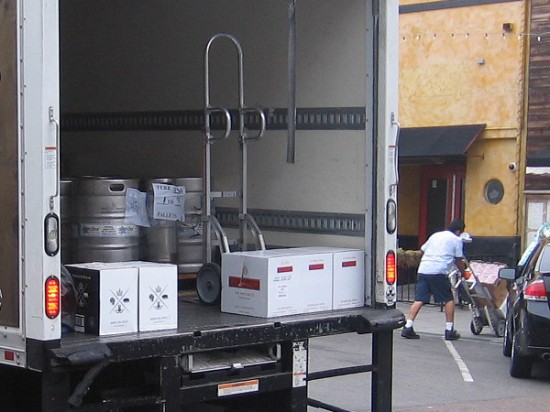 Typical early morning deliveries in Little Italy include kegs of beer and boxes of spirits.