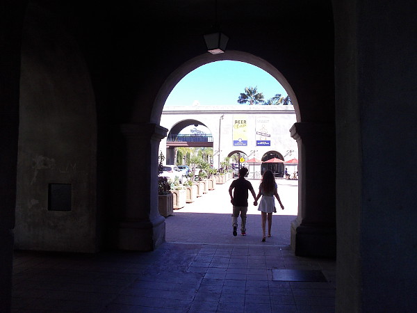 A pair holds hands as they enter Balboa Park on Valentine's Day.