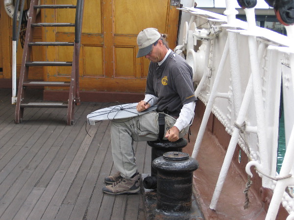 Volunteer on Star of India is preparing to hoist this plastic cap up to the top of the foremast, which is open and exposed to the elements.
