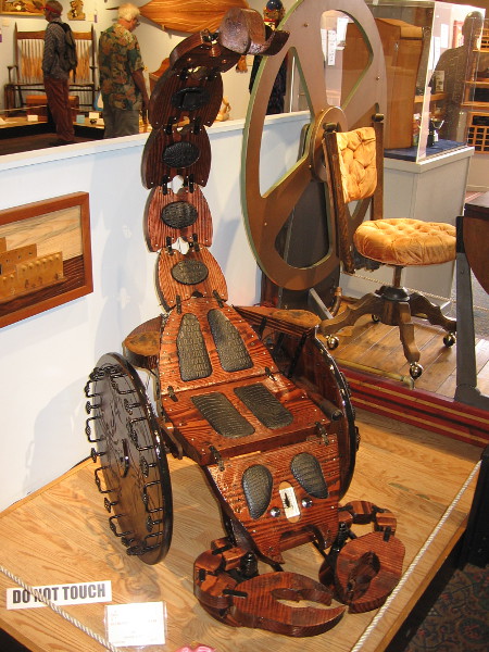 Yikes! Get out of the way! This eye-catching contraption is just too cool. Scorpion Wheelchair, Pine, Roger Aceve.