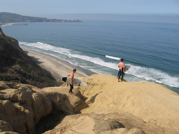 A couple of surfers prepare to descend the cliff to Black's Beach far below. For those who don't follow the established trail, it can be a very treacherous descent, and one occasionally sees rescues on the local news.