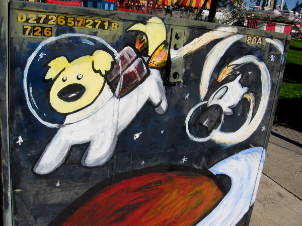 A dog in a space helmet joyfully rockets above a ringed planet.
