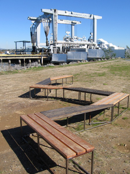The huge travelift at Marine Group Boat Works in Chula Vista is seen beyond the benches. Super yachts and large boats can be lifted out of the water there.