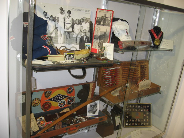A display case shows artifacts relating to the history of organized archery and Easton bows and arrows.