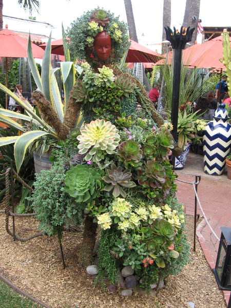 Between the stage and nearby outdoor restaurant is this stunning dancer. Art made entirely of succulents.
