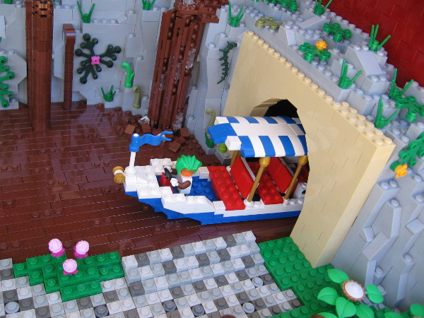Here comes an Oompa Loompa sailing down the chocolate river! The Chocolate Room was built by LEGO master John Cooper!