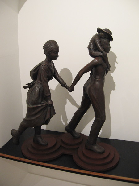 I'll Fly Away. Manuelita Brown, bronze with painted wood base, 2003.
