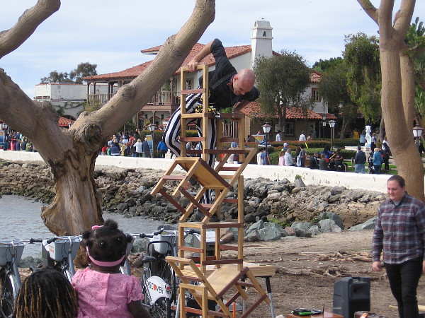 Dango (Derrick Gilday of San Diego) climbs a stack of chairs near Seaport Village.