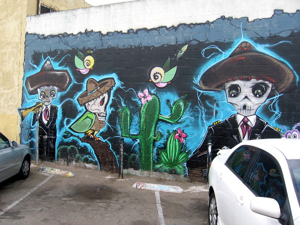 A mural titled The Garden Party by artists Althea Rose Neff, Gilbert Cota and Alex Malone.