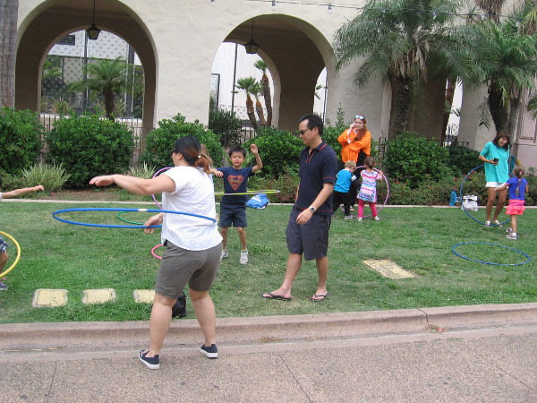 Lots of people were enjoying hula hoops on the grass!