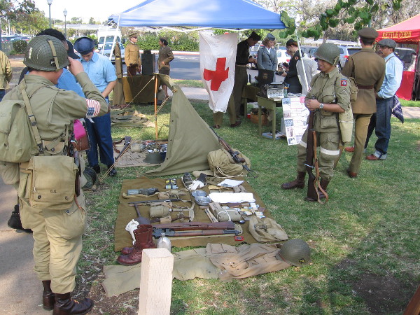 Members of the reenactment group displayed artifacts from past wars, and wore military uniforms.