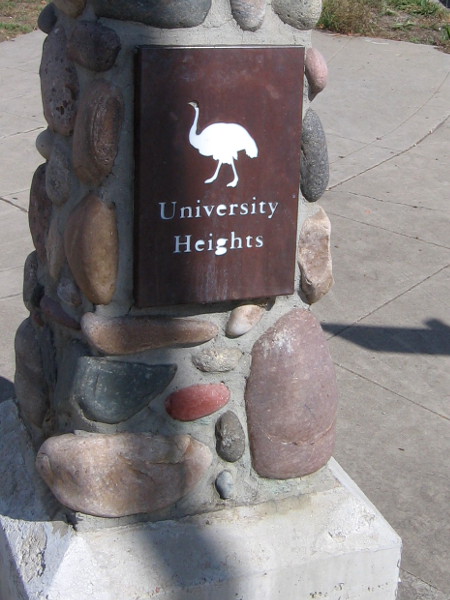 A small sign with ostrich welcomes those walking up Park Boulevard to University Heights.