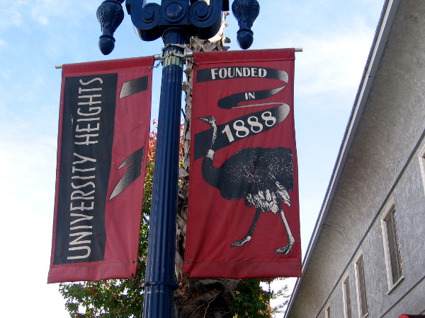 Street lamp banner with ostrich proclaims University Heights - Founded in 1888.