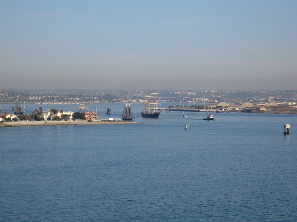 Star of India is towed past Naval Base Point Loma as it heads out of San Diego's harbor toward the open ocean.