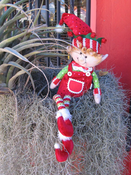 A happy elf was lurking near one of the Spanish Village artist studios.