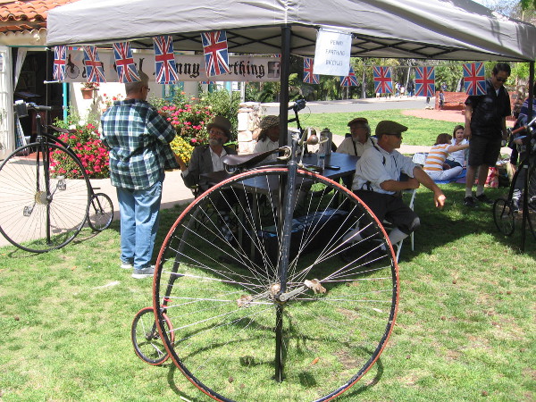 Some guys rode penny-farthings to Balboa Park's fun House of England lawn program.