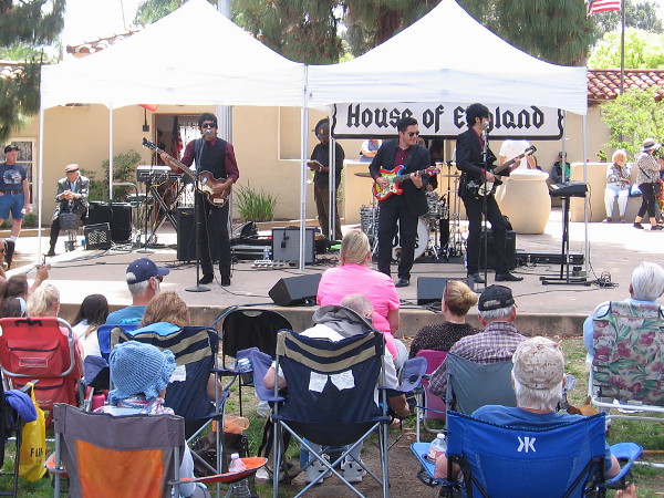 The Baja Bugs, a great Beatles tribute band, rocks the House of England's lawn program.
