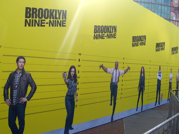At the Brooklyn Nine-Nine offsite, fans of the show can take a selfie in a lineup with various characters.