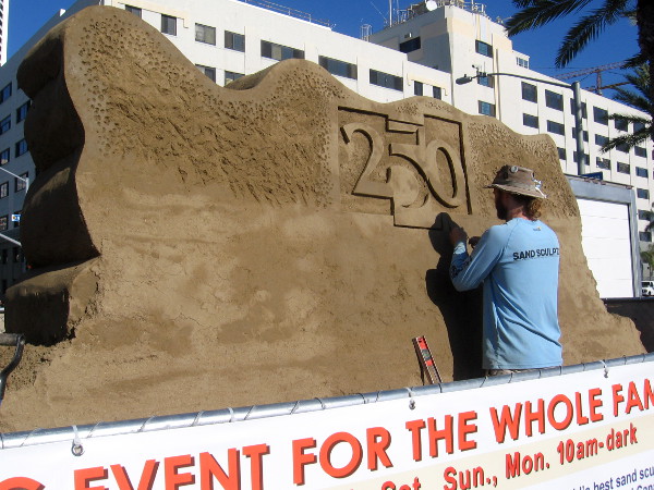 On the other side of the welcoming sand sculpture, a design is being carved that celebrates the 250th anniversary of the city of San Diego!