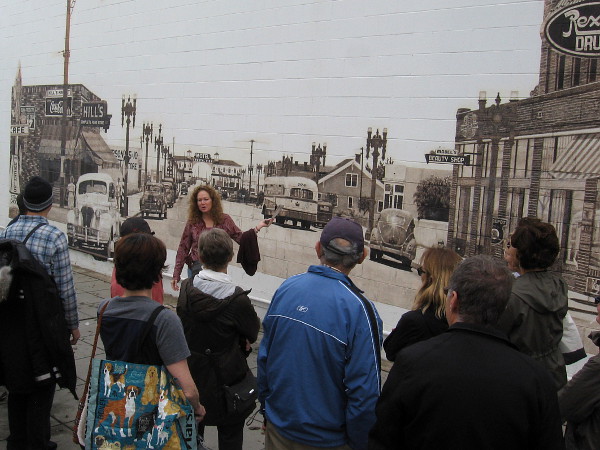 Our group meets muralist Kathleen King, whose 1988 mural was painted from a 1943 photo of Garnet Avenue, looking west toward Crystal Pier.