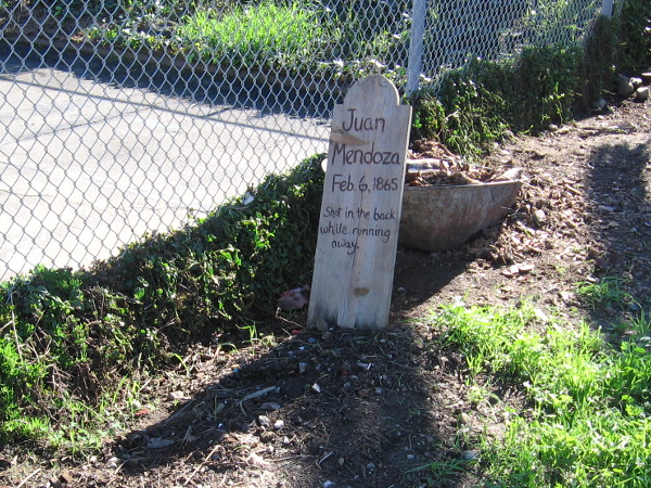 Mysterious wooden tombstone with name of Juan Mendoza, who was shot by Cave Couts in the back with a double-barreled shotgun in Old Town San Diego, February 6, 1865.